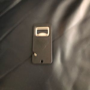 Columbia fishing line cutter and beer bottle opener.